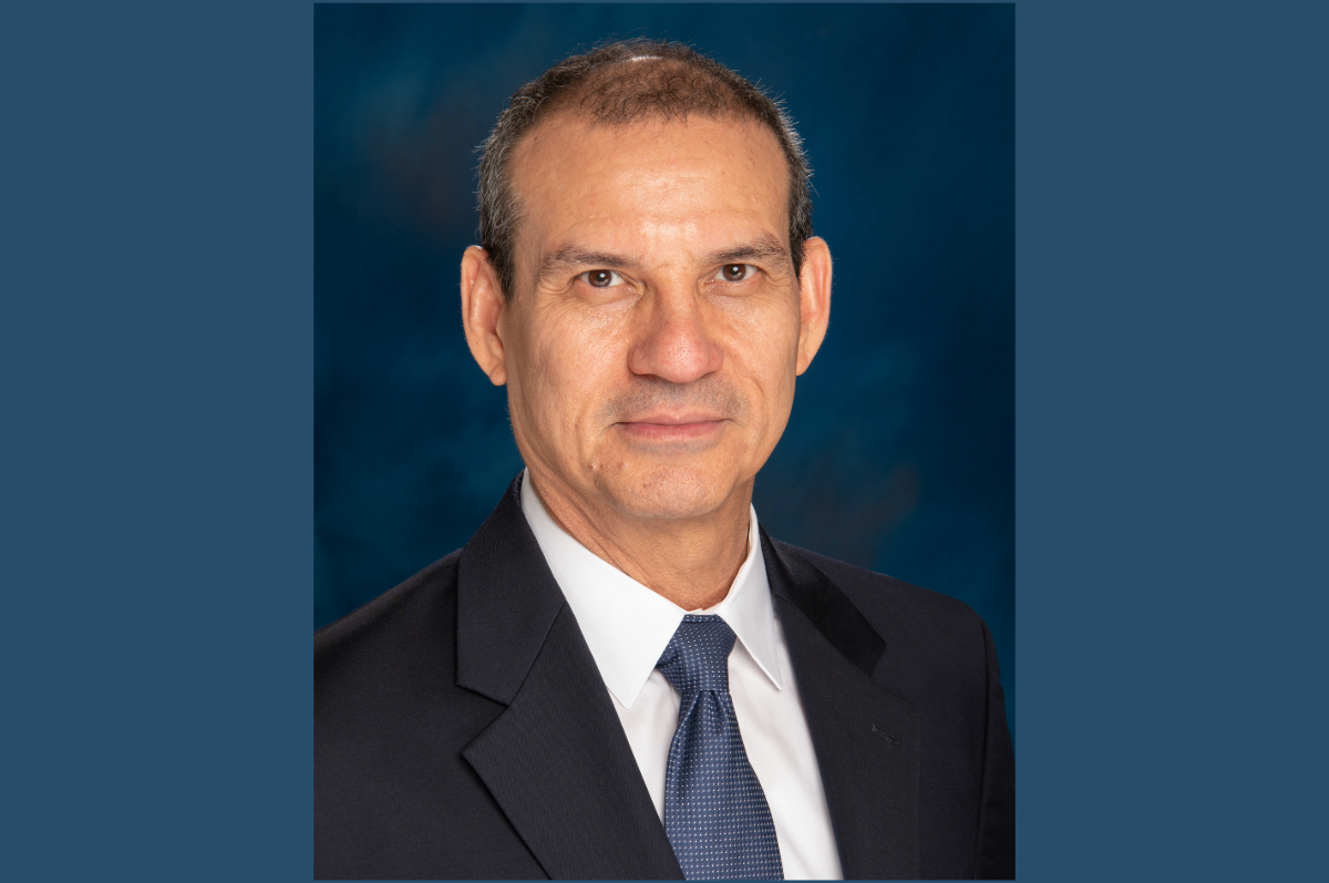 portrait of man in blue suit